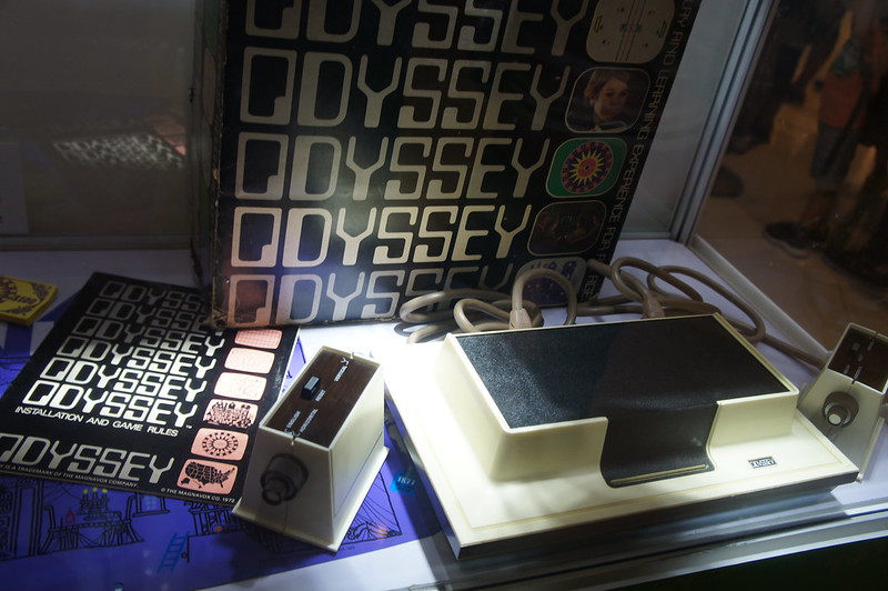 Magnavox Odyssey game console displayed with packaging and controller