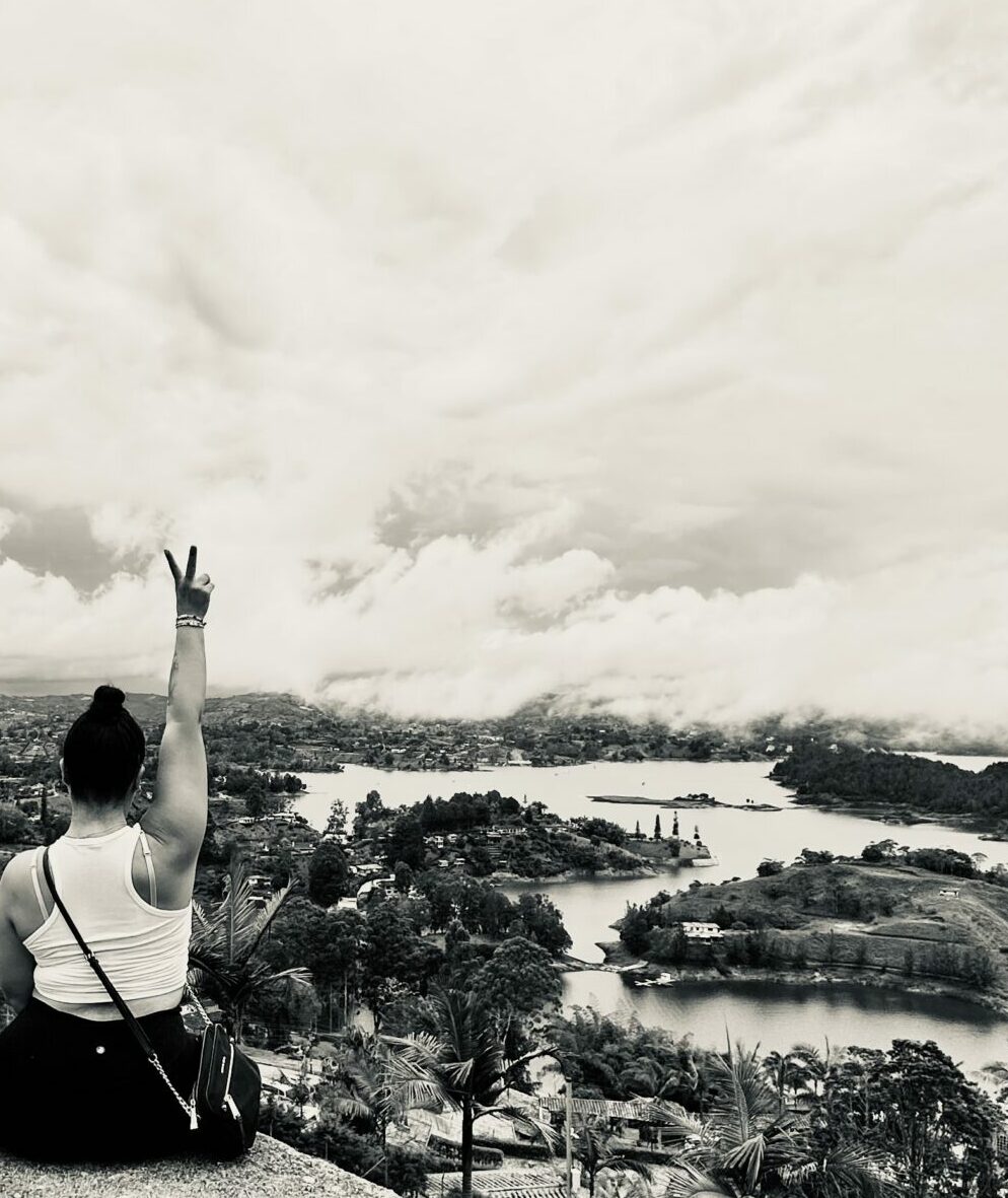 Sitting on a ledge in Guatape, Colombia