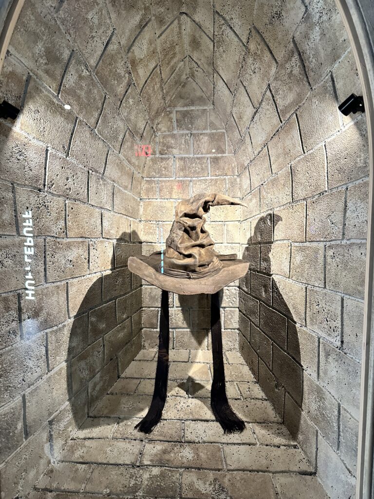 Image of an encased sorting hat at the NYC Harry Potter Exhibition